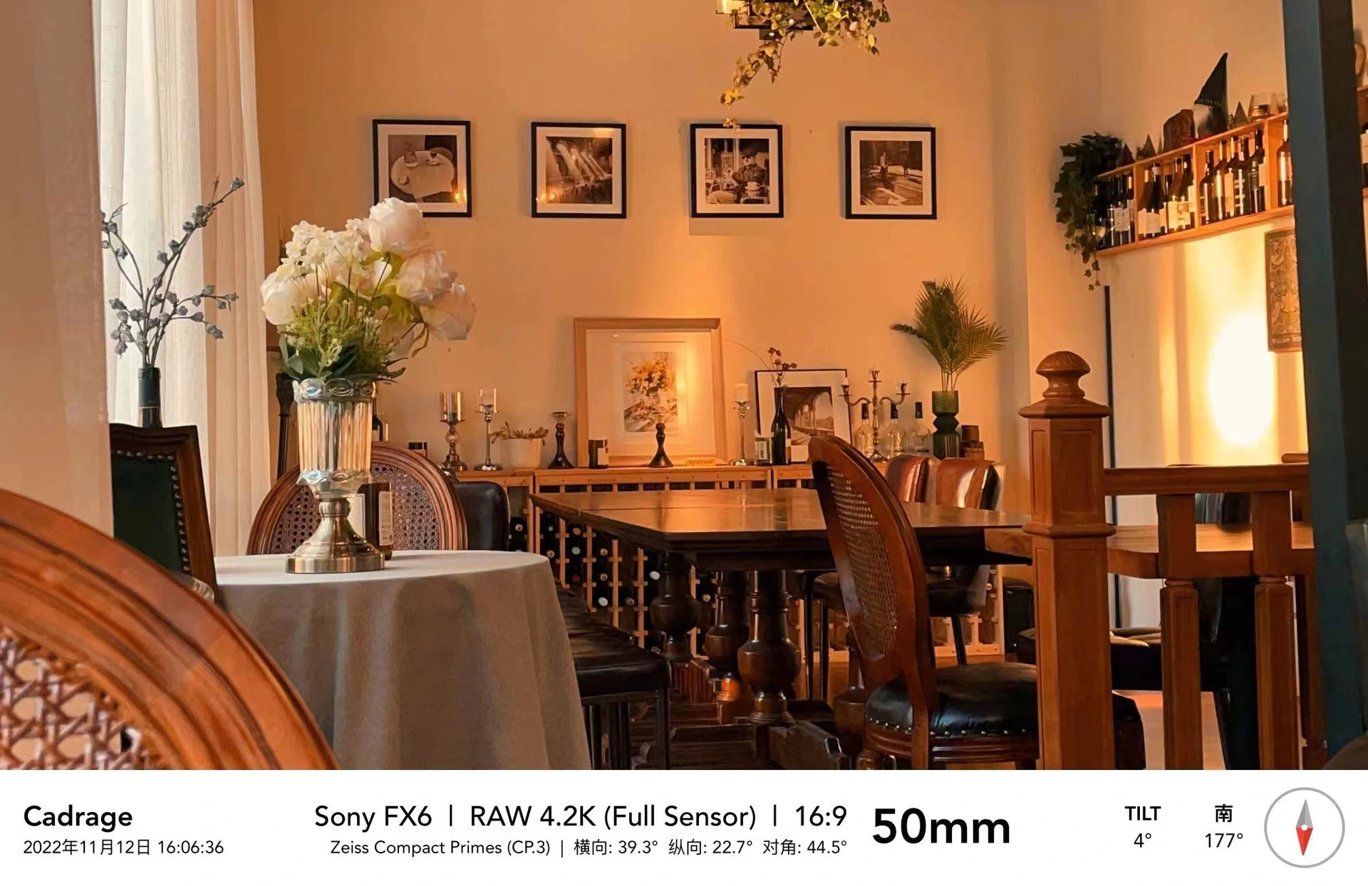 Flowers and a small dining table in a warm Pure Wine interior